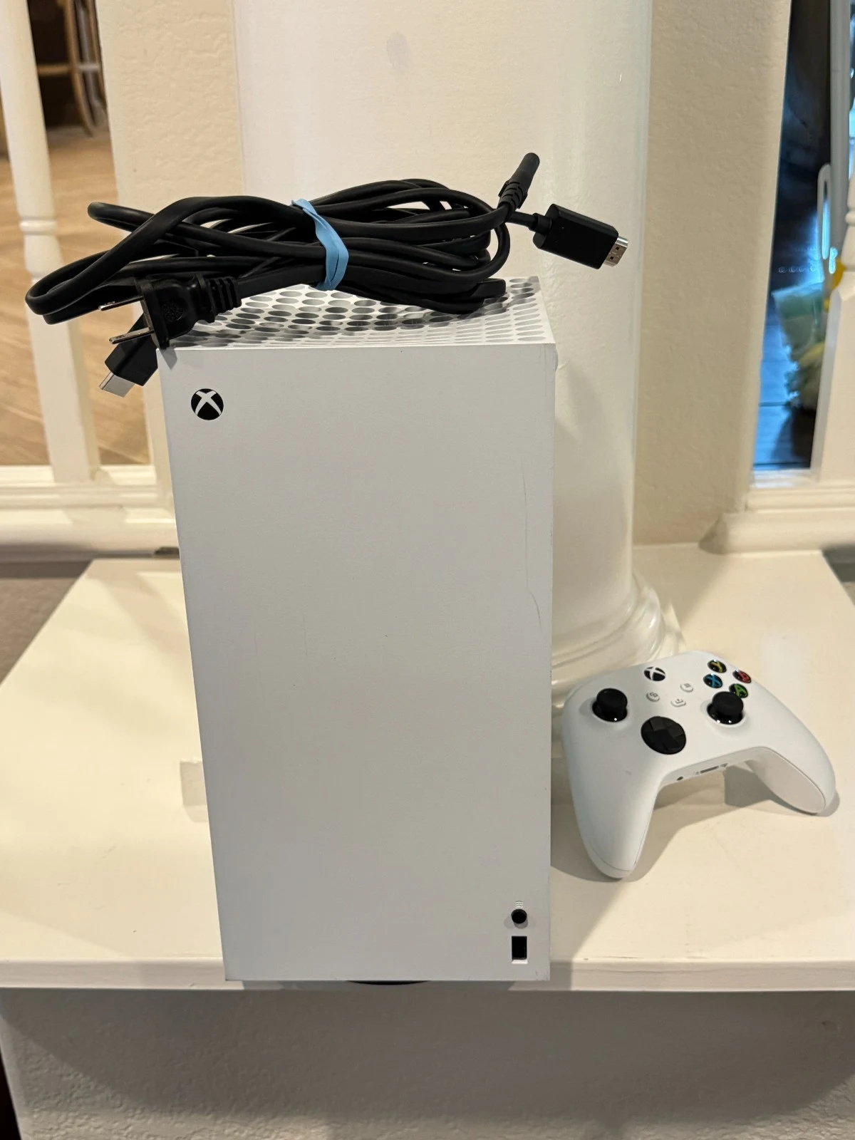 Original listing photo of a white Xbox console with its controller and coiled cables